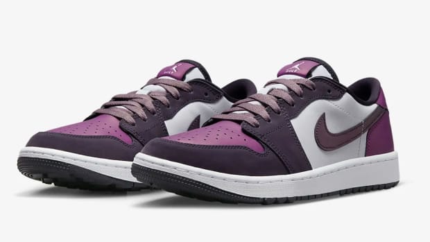 View of purple and white Jordan shoes.